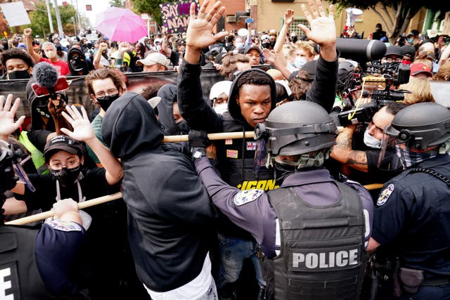 <p>Police and protesters converge during a demonstration, Wednesday, Sept. 23, 2020, in Louisville, Ky</p>