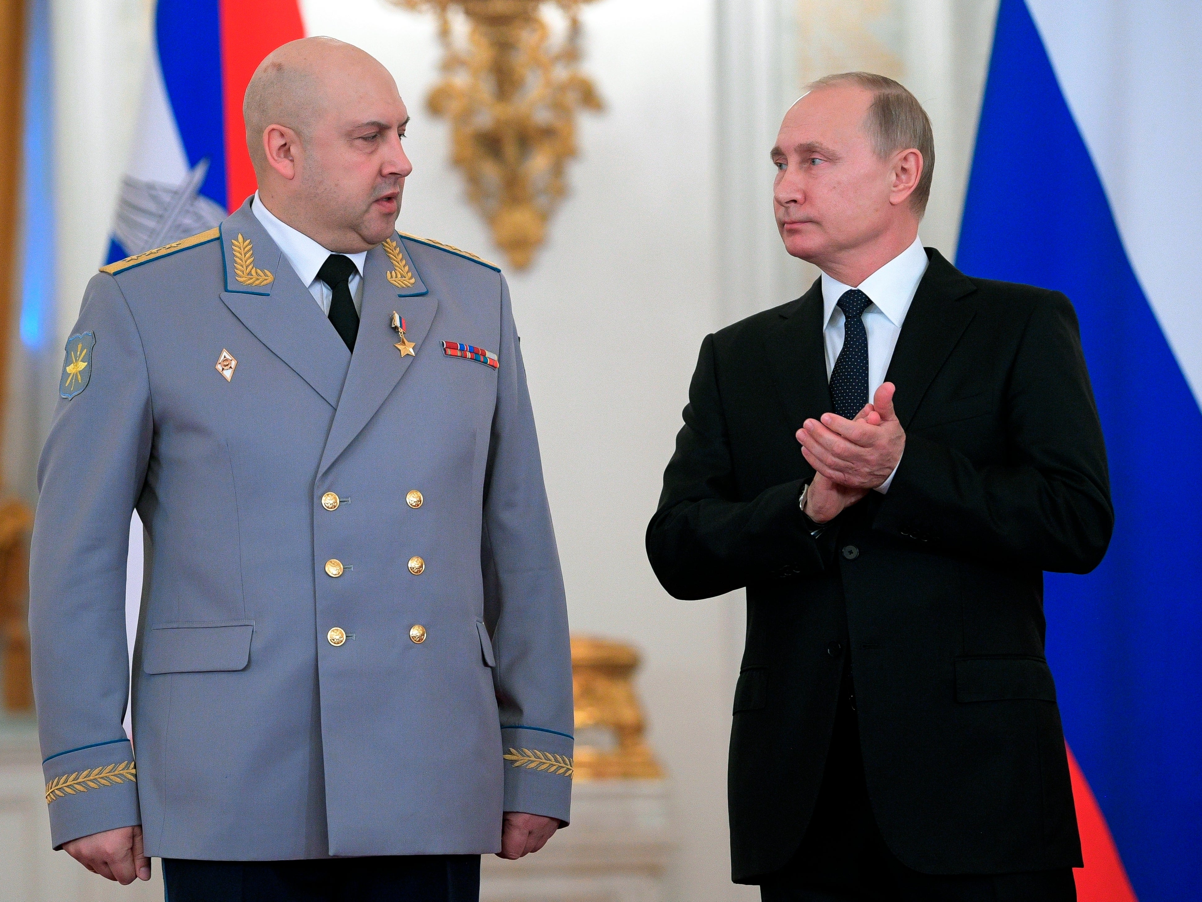 Sergei Surovikin, pictured with Vladimir Putin, is alleged to have been involved in war crimes in Syria