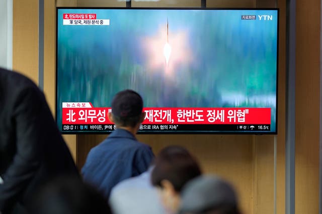 <p>A TV screen showing a news program reporting about North Korea's missile launch</p>