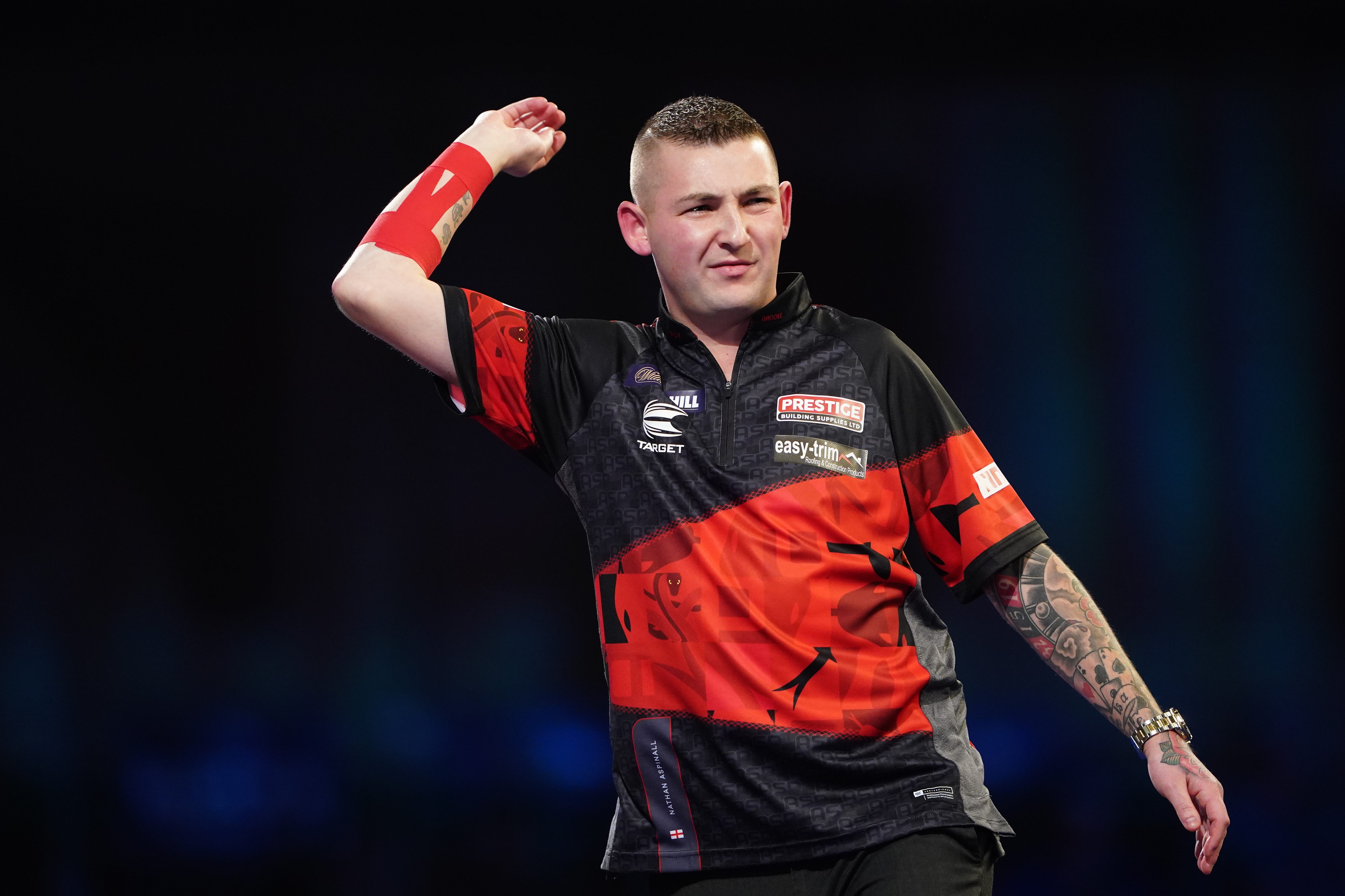 Nathan Aspinall will play in his first World Grand Prix final after beating world number one Gerwyn Price in the final four (Zac Goodwin/PA)