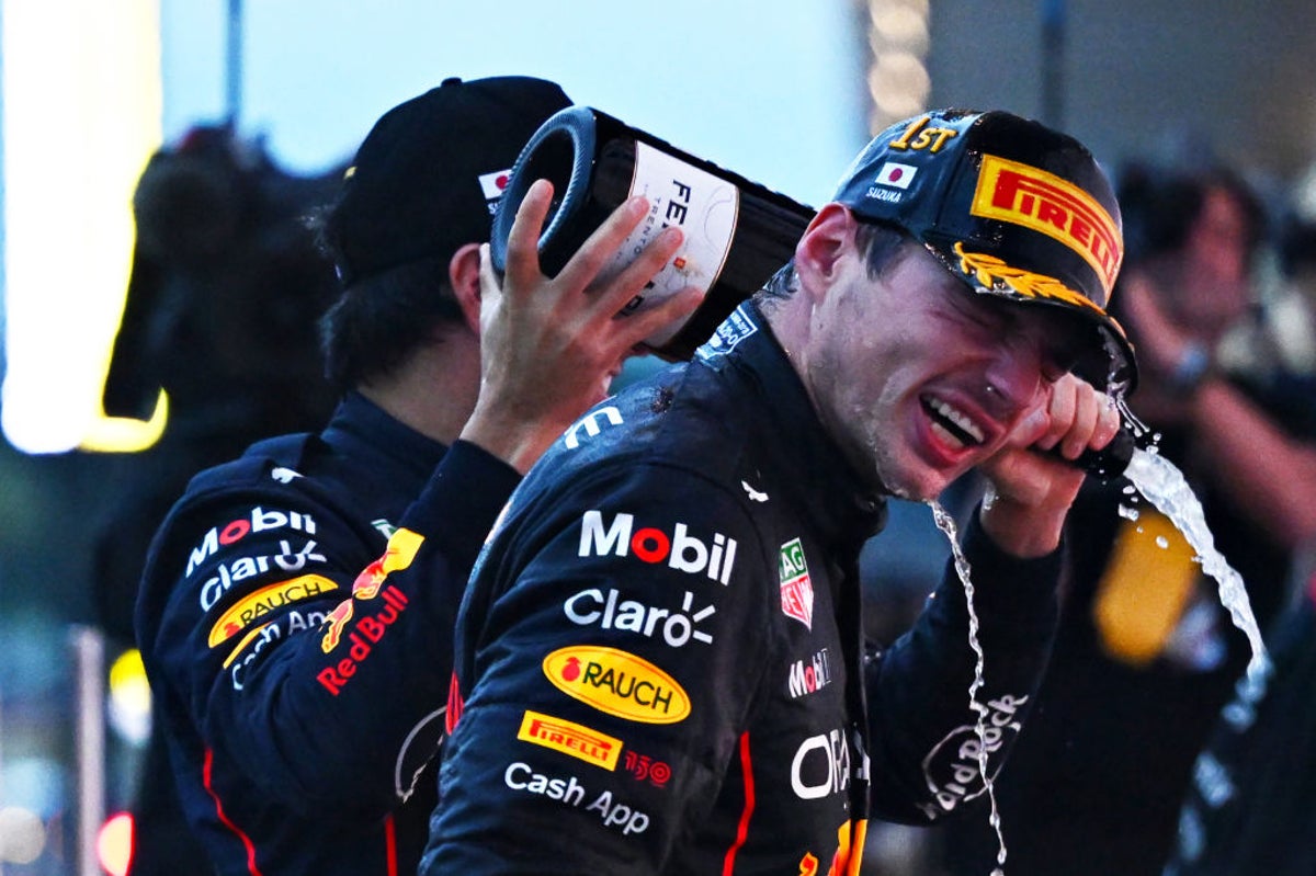 Verstappen wins chaotic, rain-shortened Japanese GP to clinch title