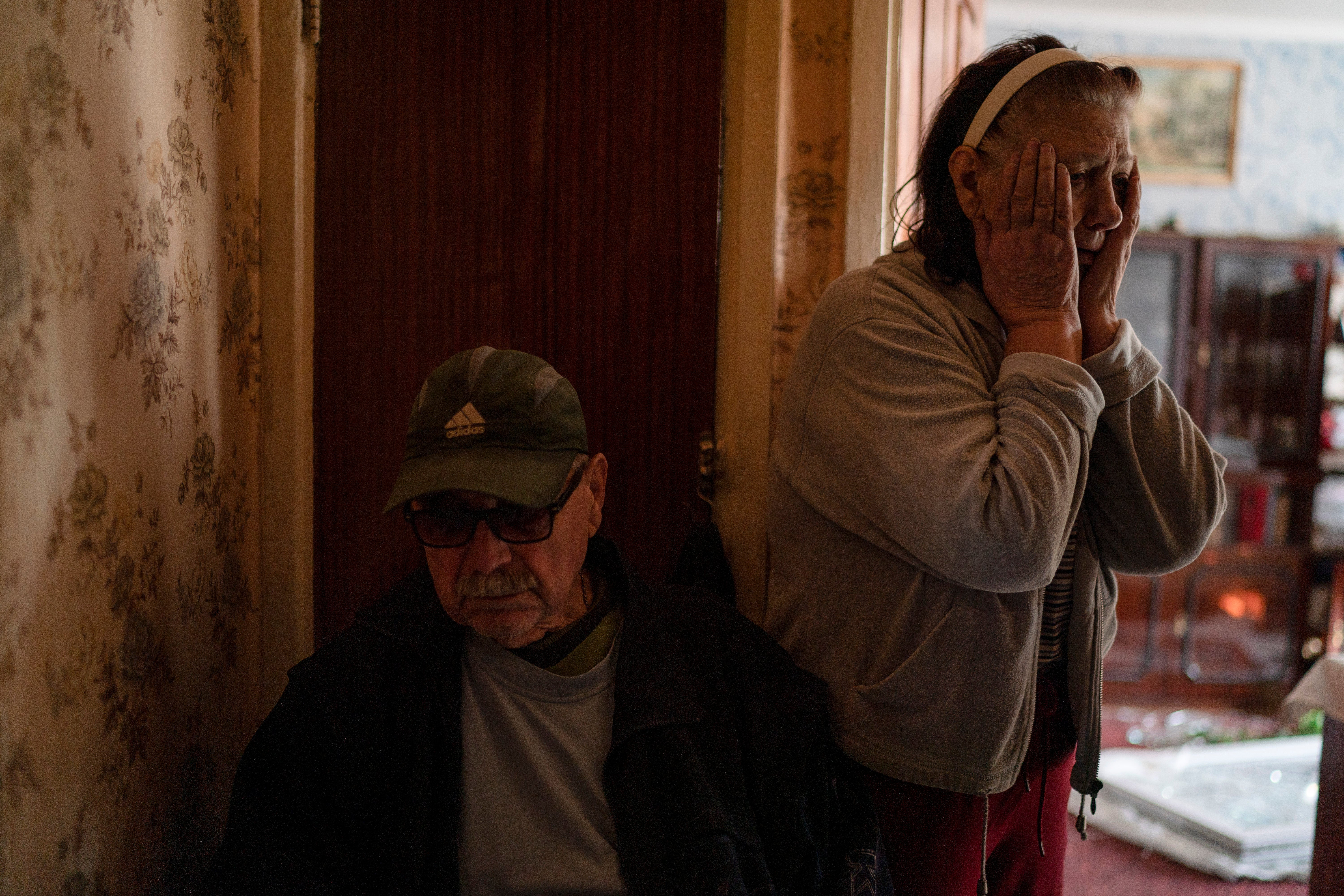 Tetyana and Oleksii Lazunko, distraught that their home for more than 40 years has been ruined