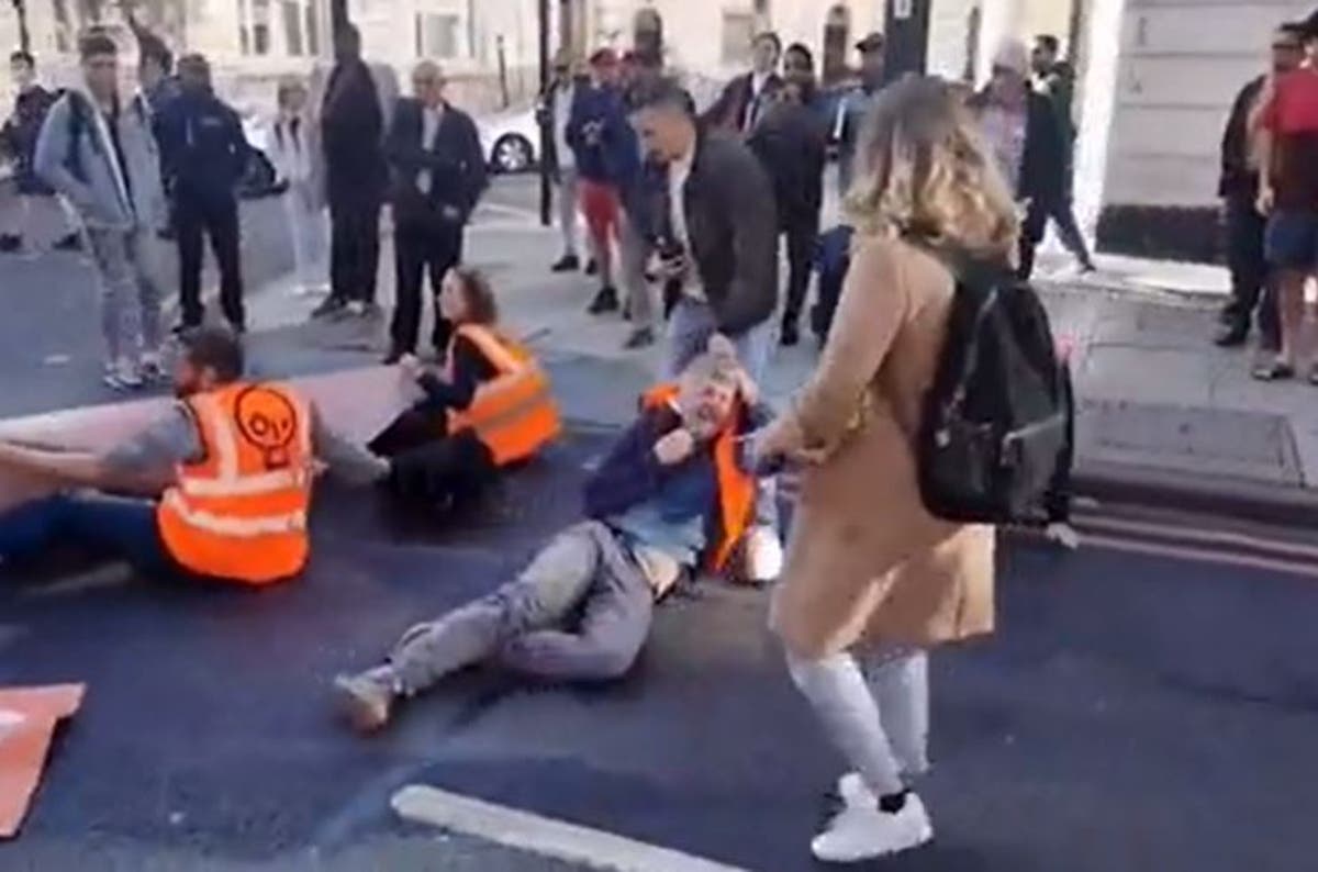 Angry motorists drag Just Stop Oil protesters out of road as 100 activists arrested