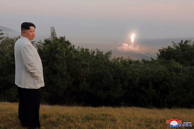 <p>North Korean leader Kim Jong-un inspects a missile test at an undisclosed location in North Korea, as taken sometime between 25 September and 9 October</p>