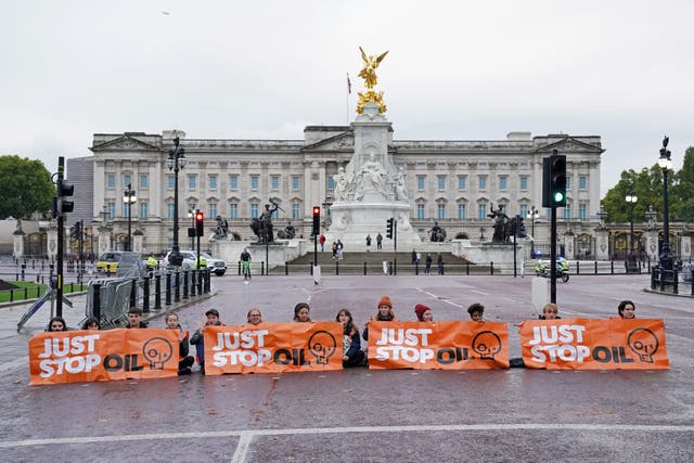 <p>Just Stop Oil protesters block off The Mall in front of Buckingham Palace</p>