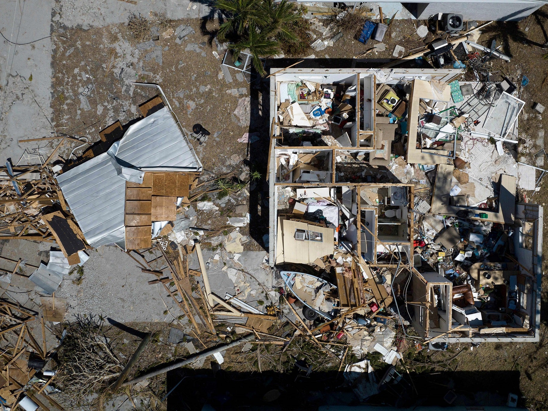 <p>An aerial picture taken on 3 October, 2022 shows a destroyed house in the aftermath of Hurricane Ian in West Inland, Matlacha, Florida</p>