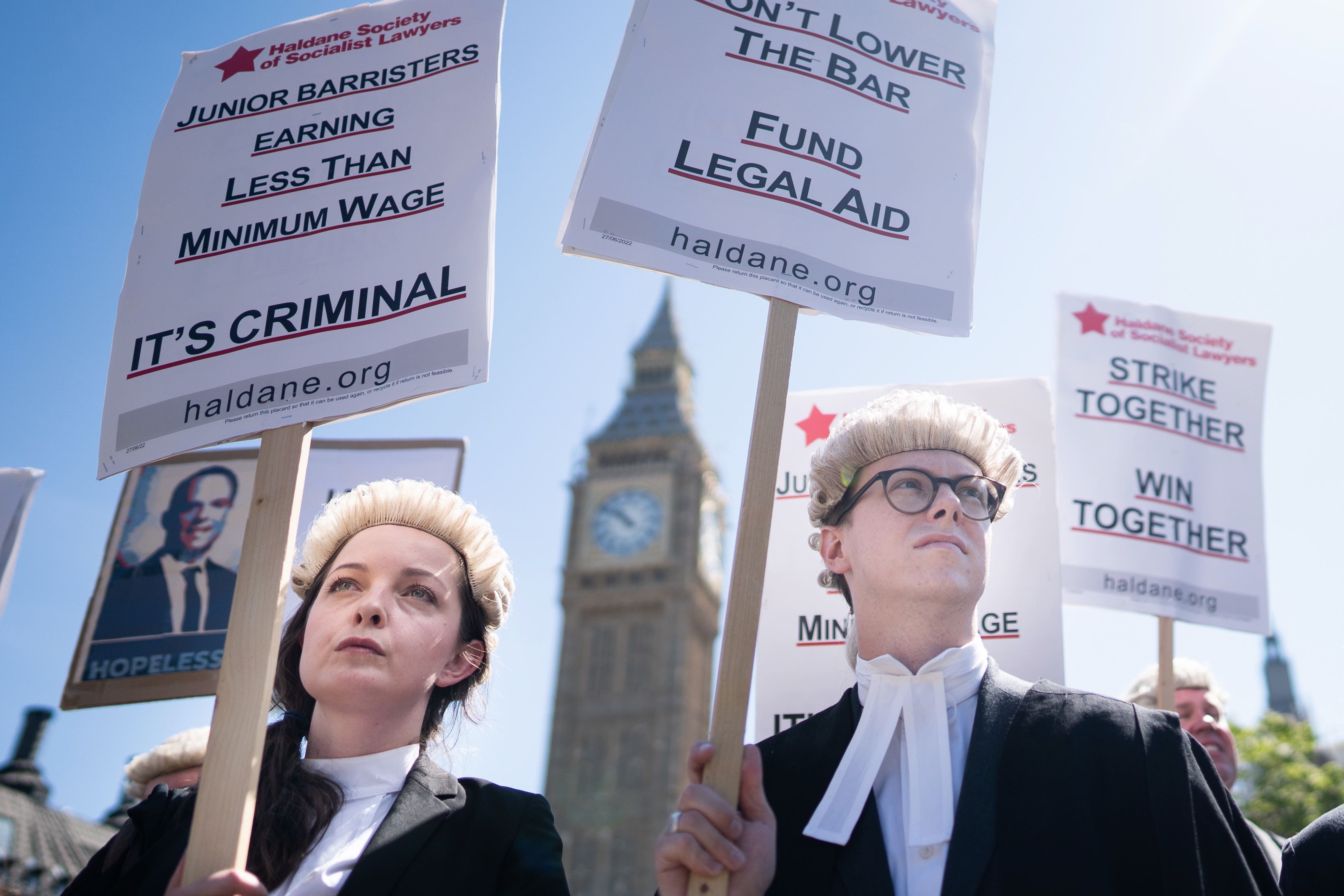 Criminal barristers in England and Wales will head back to work after voting to accept a pay offer from the Government and end long-running strike action (PA)