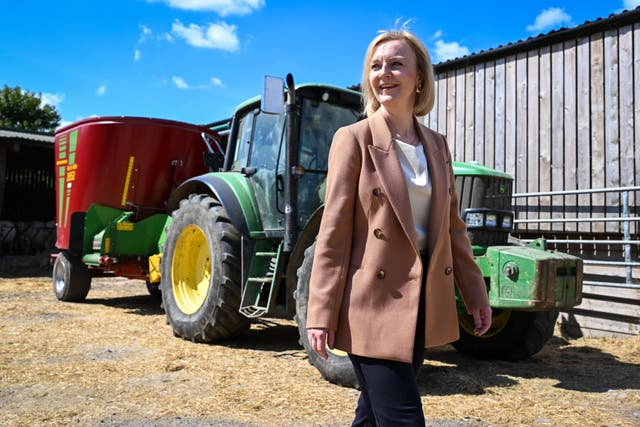 Liz Truss visits a Devon farm during the Tory leadership campaign in August (Finnbarr Webster/PA)