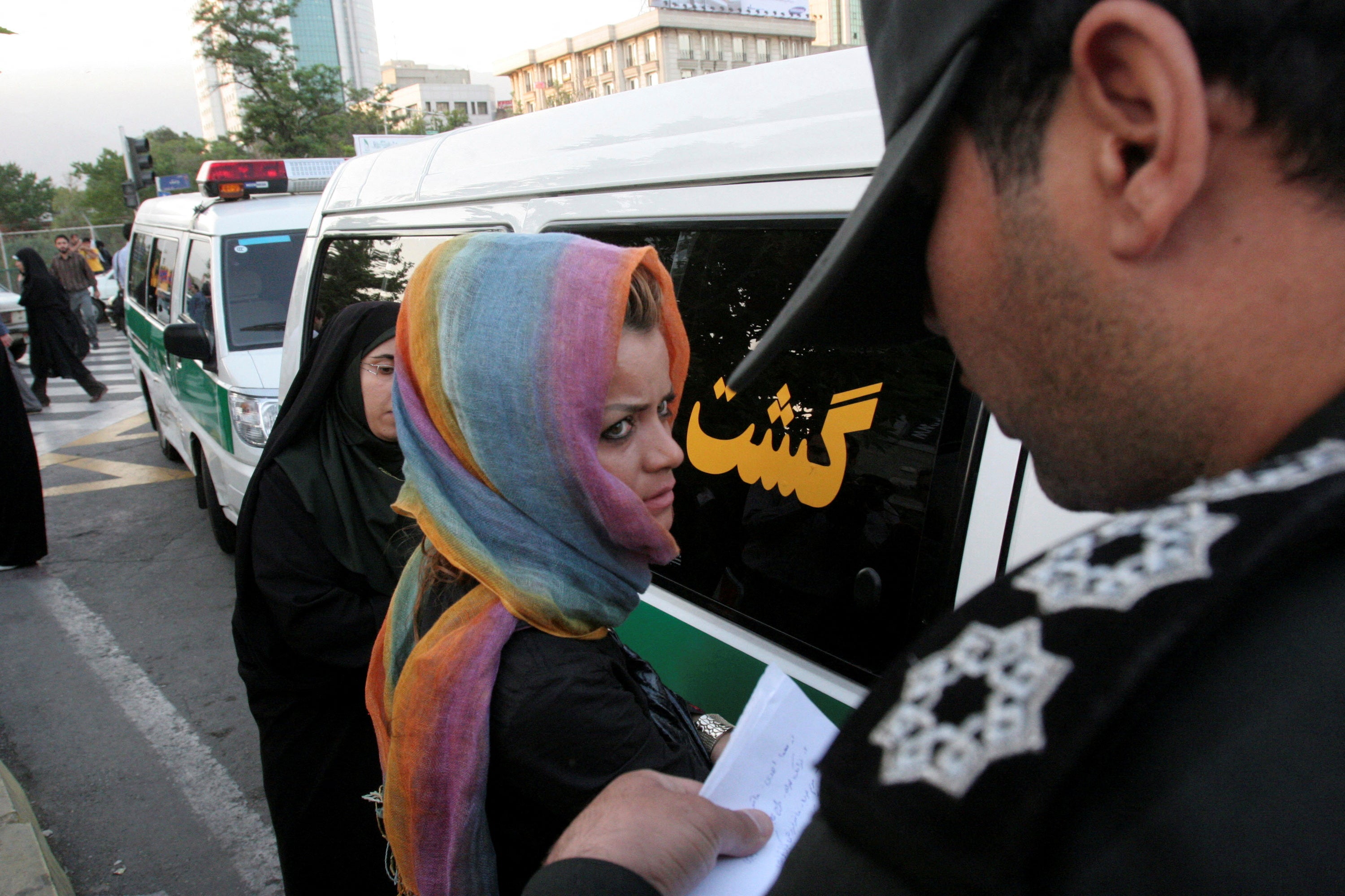 Morality police take down the name of a detained woman during a crackdown on ‘social corruption’ in north Tehran