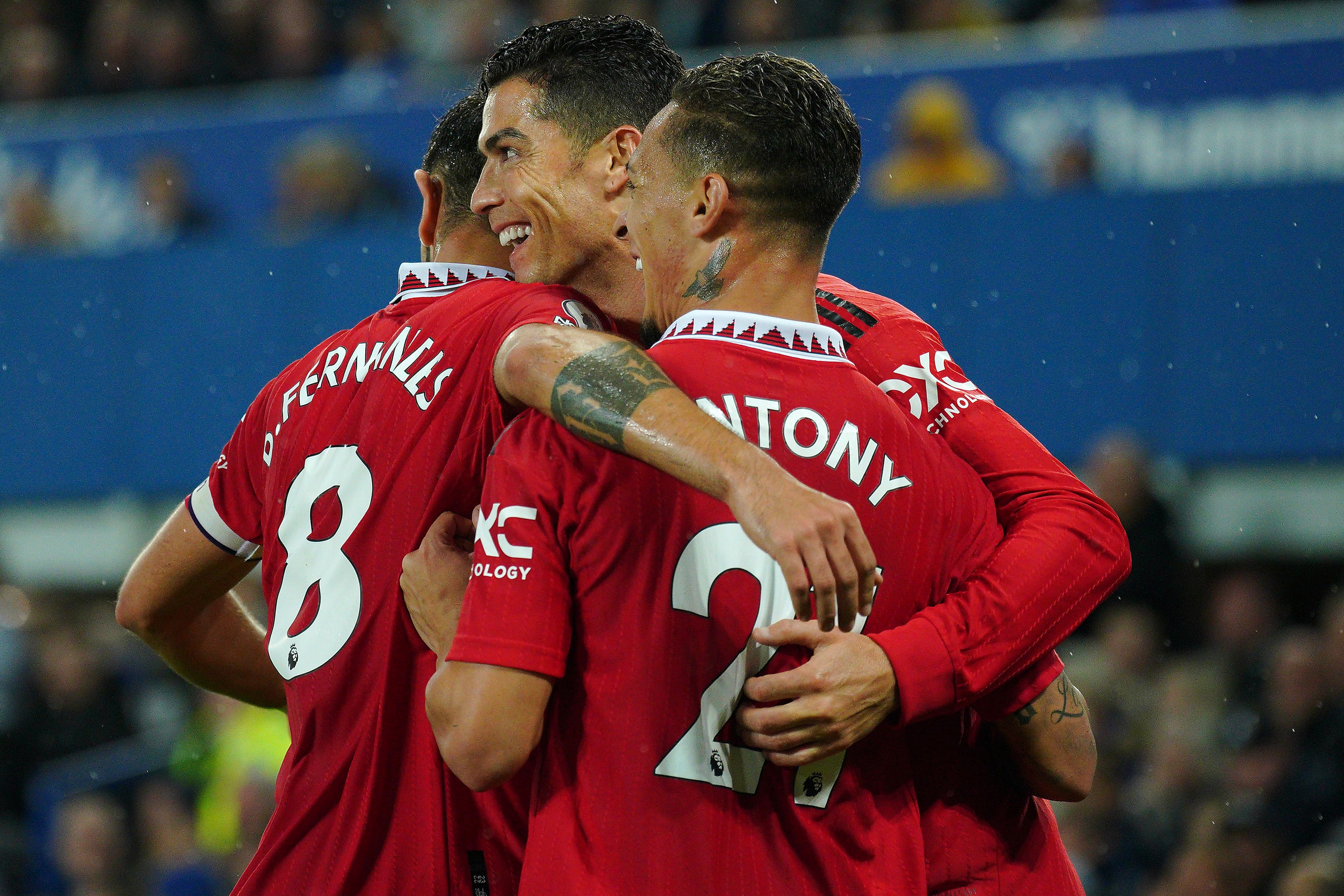 Cristiano Ronaldo (centre) celebrates after scoring for Manchester United against Everton (Peter Byrne/PA)