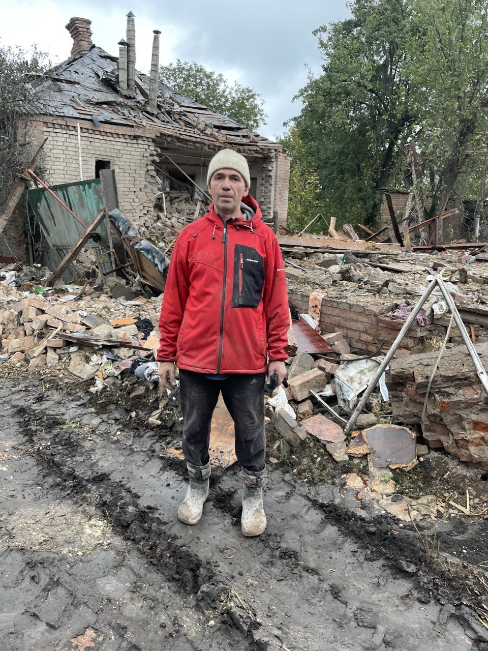 Vladimir Chumak outside the rubble of his house in Slovyansk after a Russian missile attack in which his sister-in-law Zoya was killed