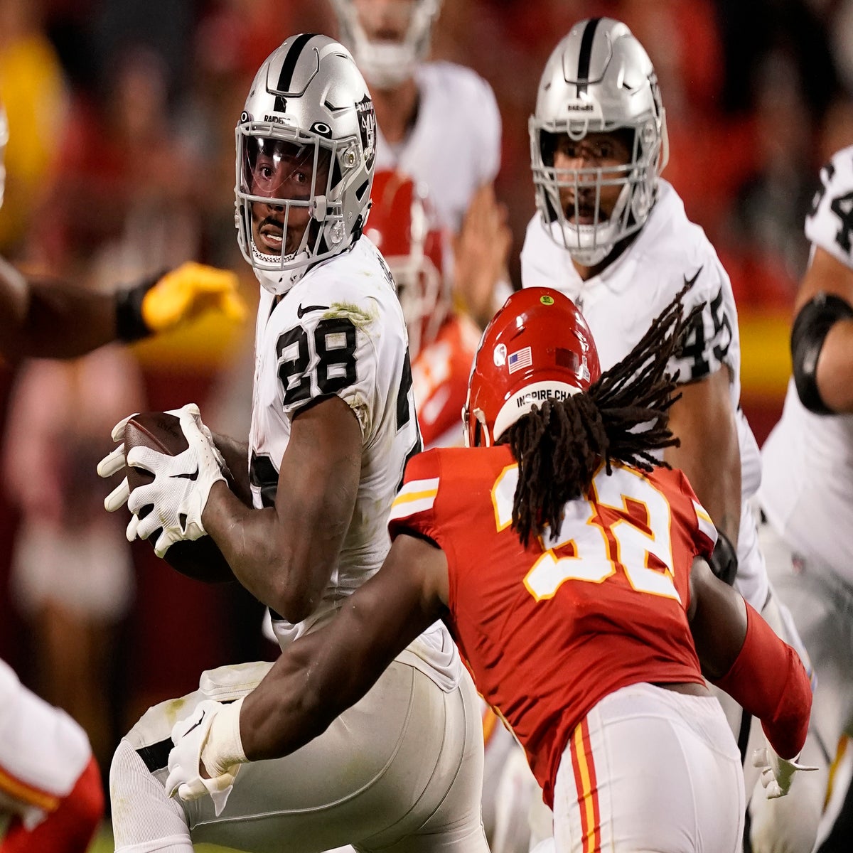 Chiefs hold on for wild 30-29 victory over rival Raiders