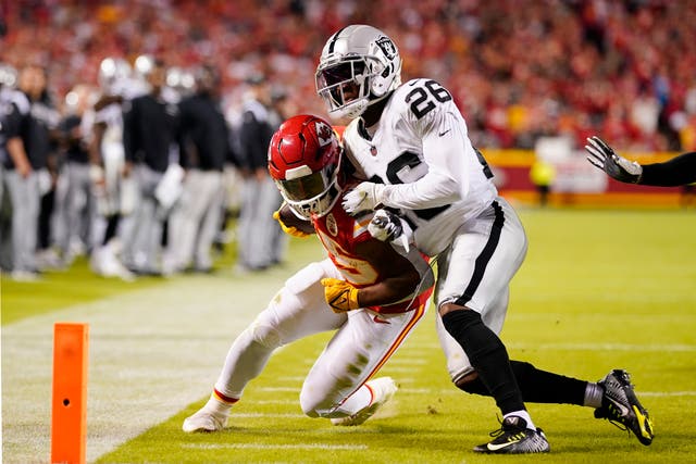 <p>Kansas City Chiefs running back Clyde Edwards-Helaire (25) runs for the end zone pressured by Las Vegas Raiders cornerback Rock Ya-Sin (26)</p>