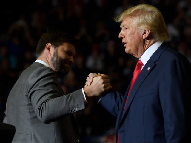 <p>JD Vance and Donald Trump at a campaign rally </p>
