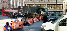 Just Stop Oil protesters in road block fire engine and ambulance during demonstration