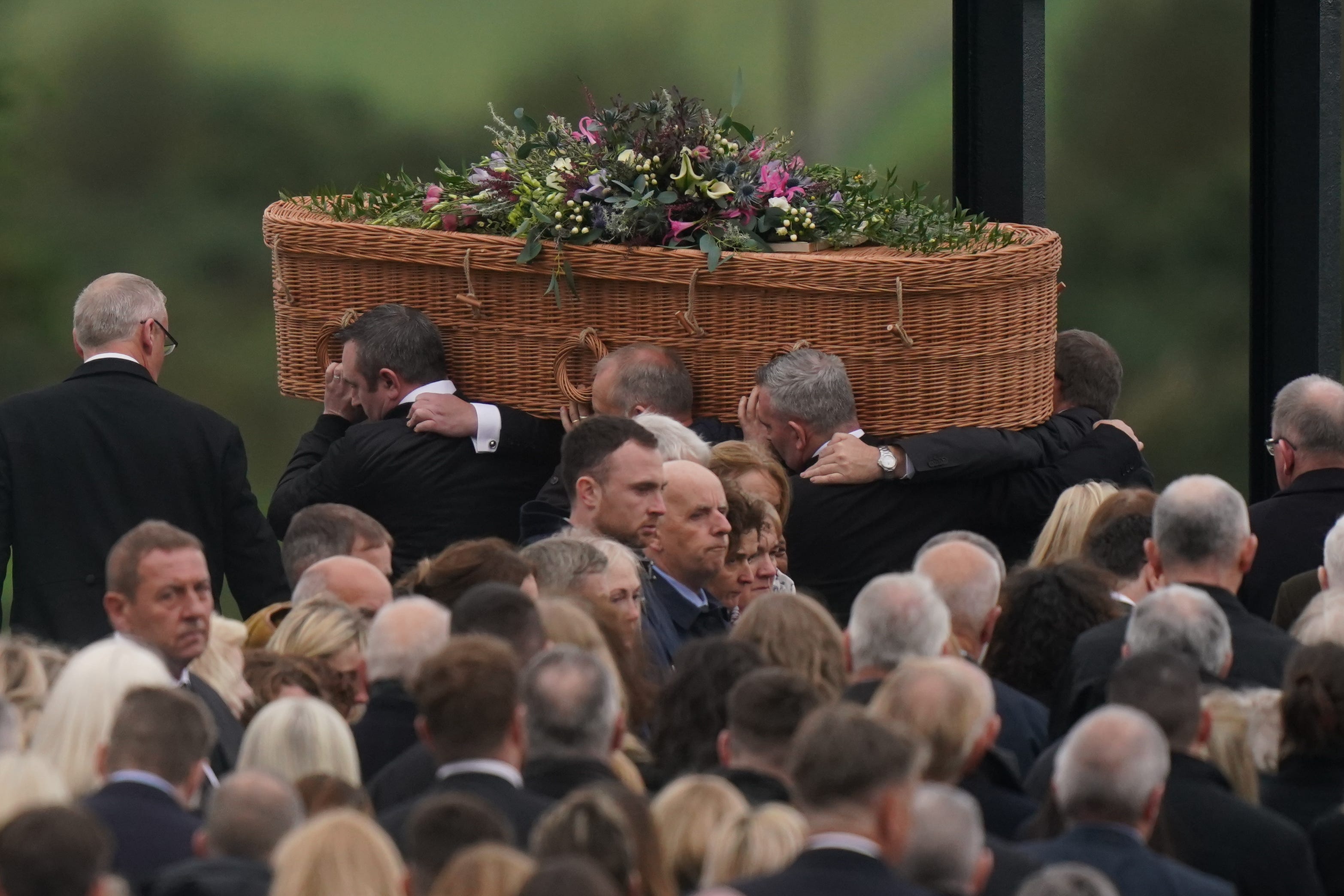 The coffin of Jessica Gallagher, 24, is carried into St Michael’s Church, Creeslough, for her funeral mass (Niall Carson/PA)