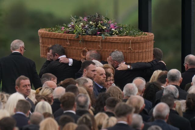 The coffin of Jessica Gallagher, 24, is carried into St Michael’s Church, Creeslough, for her funeral mass (Niall Carson/PA)