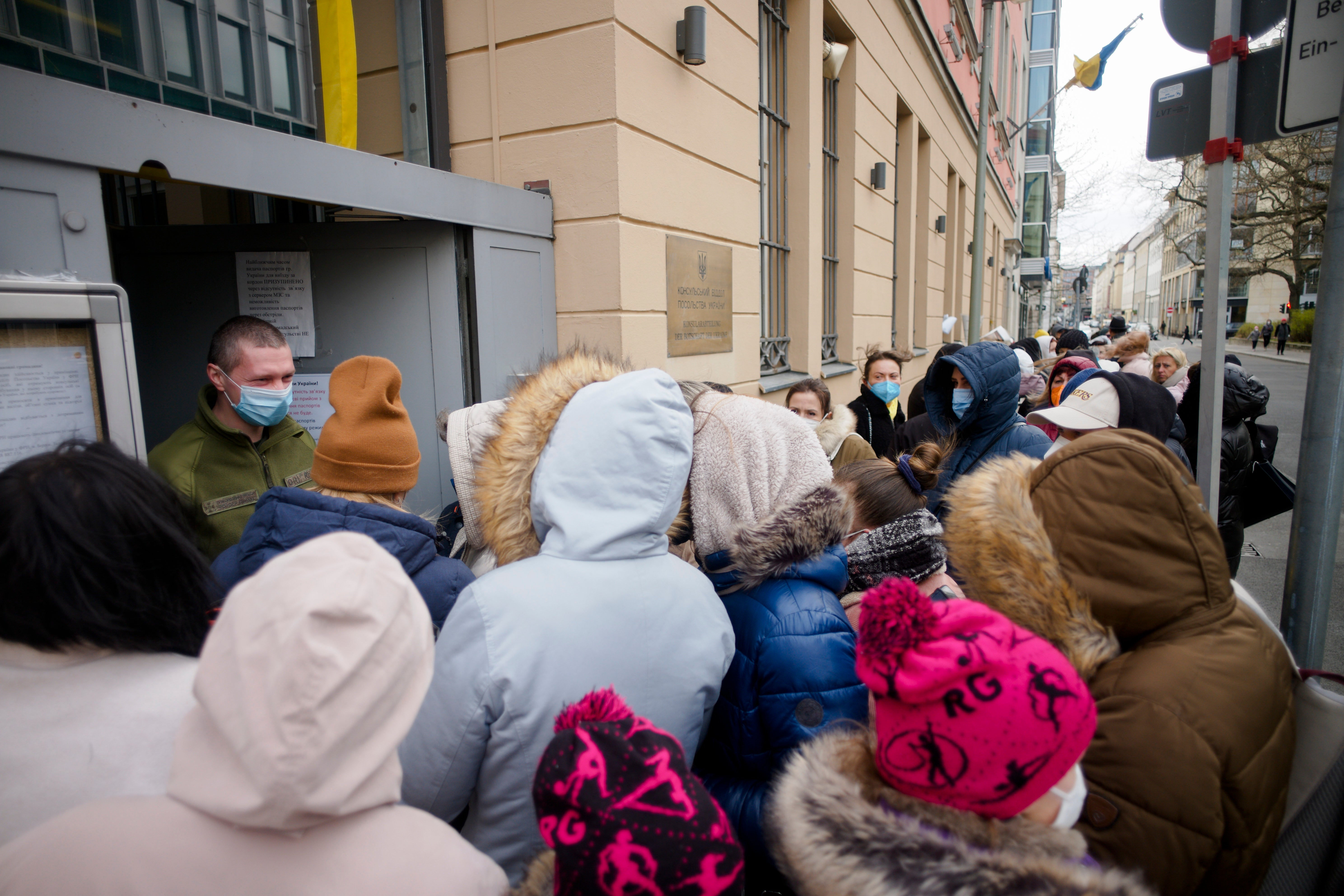 Ukrainian refugees wait in front of the consular department of the Ukrainian embassy in Berlin, Germany, in April 2022