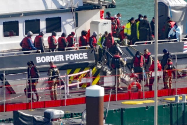 A group of people thought to be migrants are brought in to Dover, Kent, onboard a Border Force vessel following a small boat incident in the Channel. Picture date: Tuesday October 11, 2022. (Gareth Fuller/PA)
