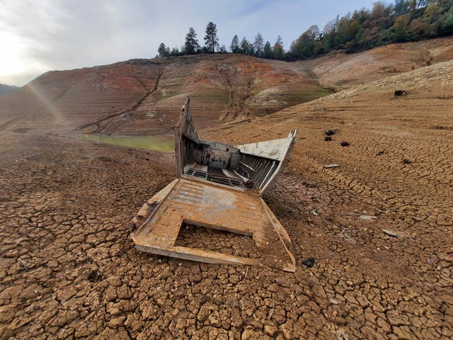 <p>The ‘ghost boat’ found on the shoreline of Shasta Lake in northern California</p>