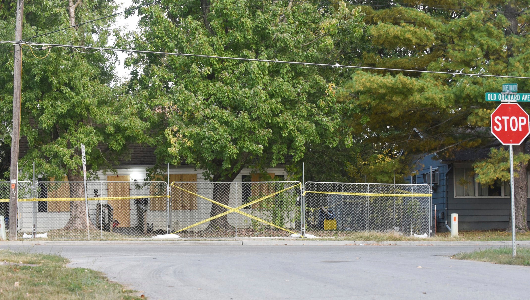 Police tape blocks off the residence of Timothy M Haslett Jr, after the home was boarded up and fenced off Monday, 10 October 2022, in Missouri’s Excelsior Springs city