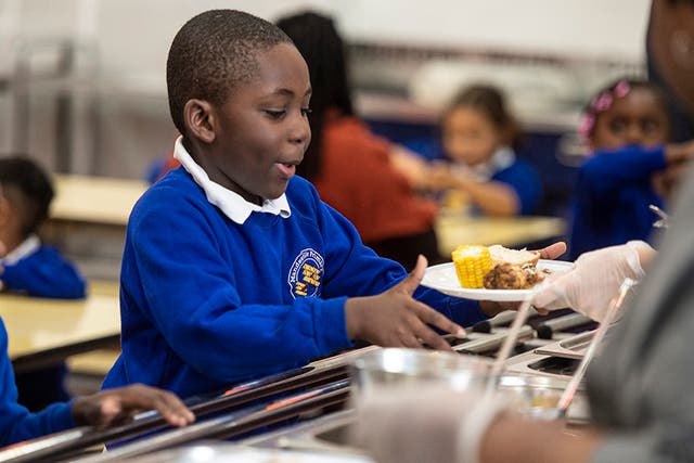 <p>Mandeville Primary in east London serves free meals to all pupils but the situation differs at other schools</p>
