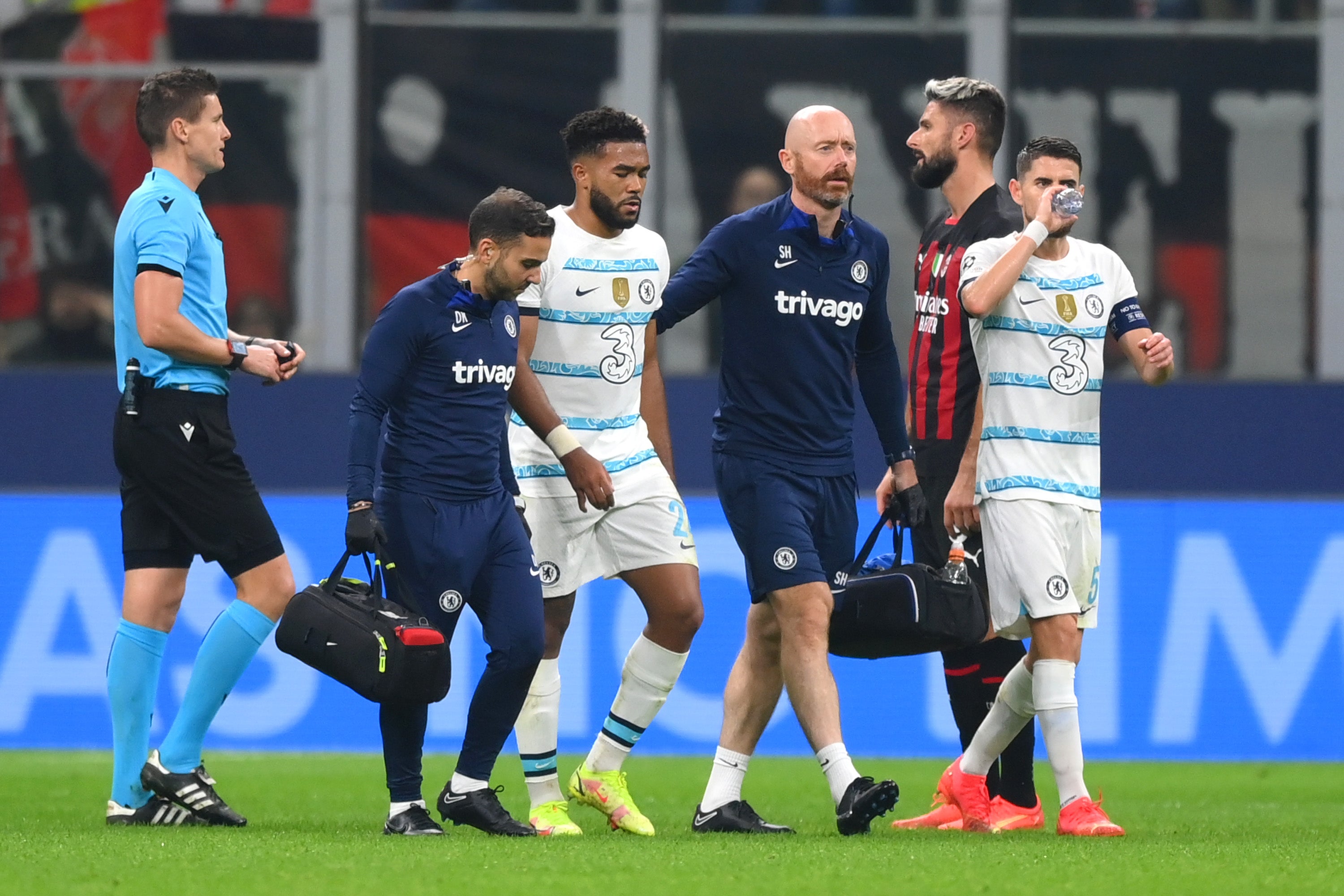 Reece James limps off after suffering an injury at the San Siro