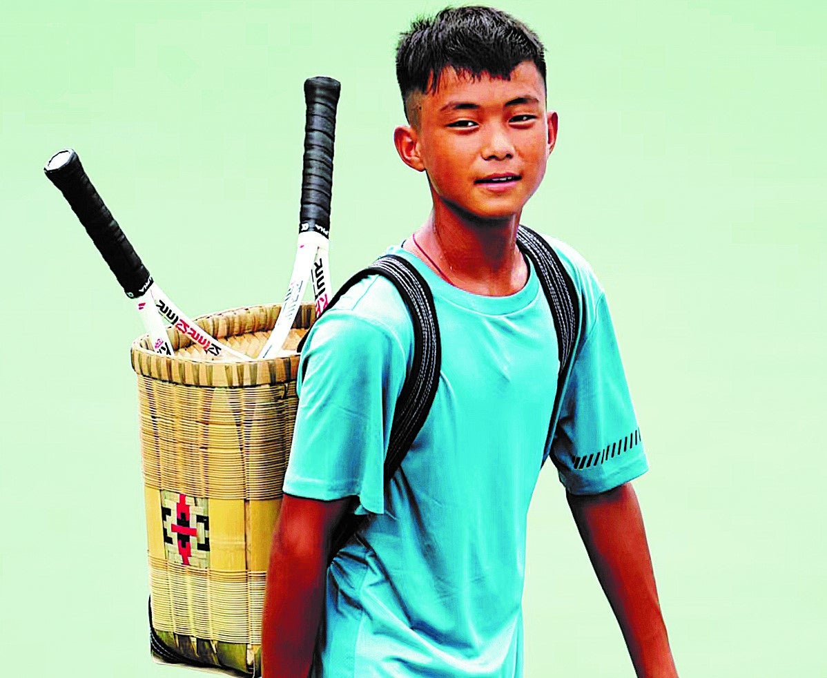 Wang Fa carries his rackets in a bamboo basket at the ASICS Tennis Junior Tour