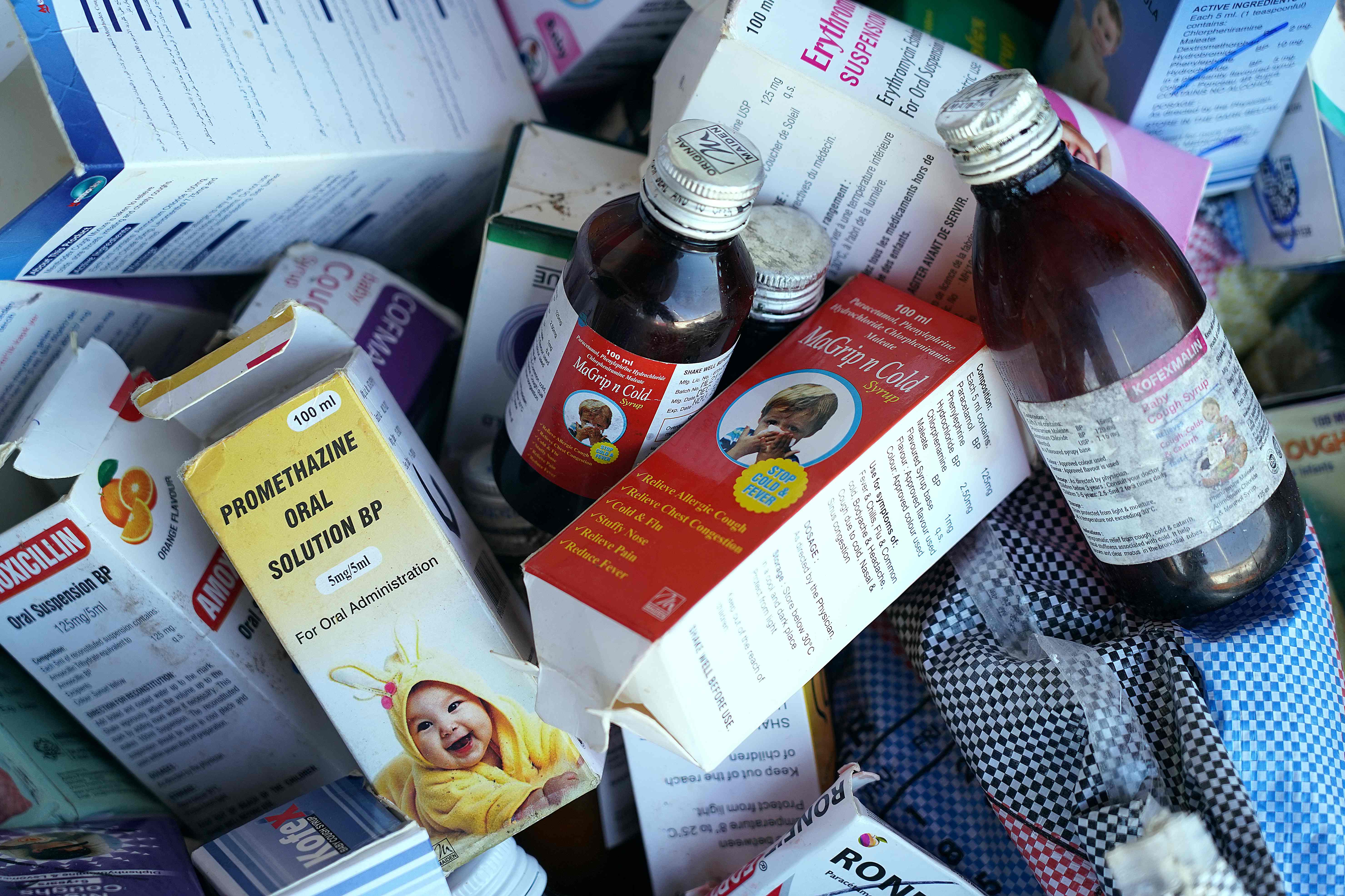 A photograph shows collected cough syrups in Banjul. Indian authorities are investigating cough syrups made by a local pharmaceutical company after the World Health Organisation said they could be responsible for the deaths of 69 children in The Gambia