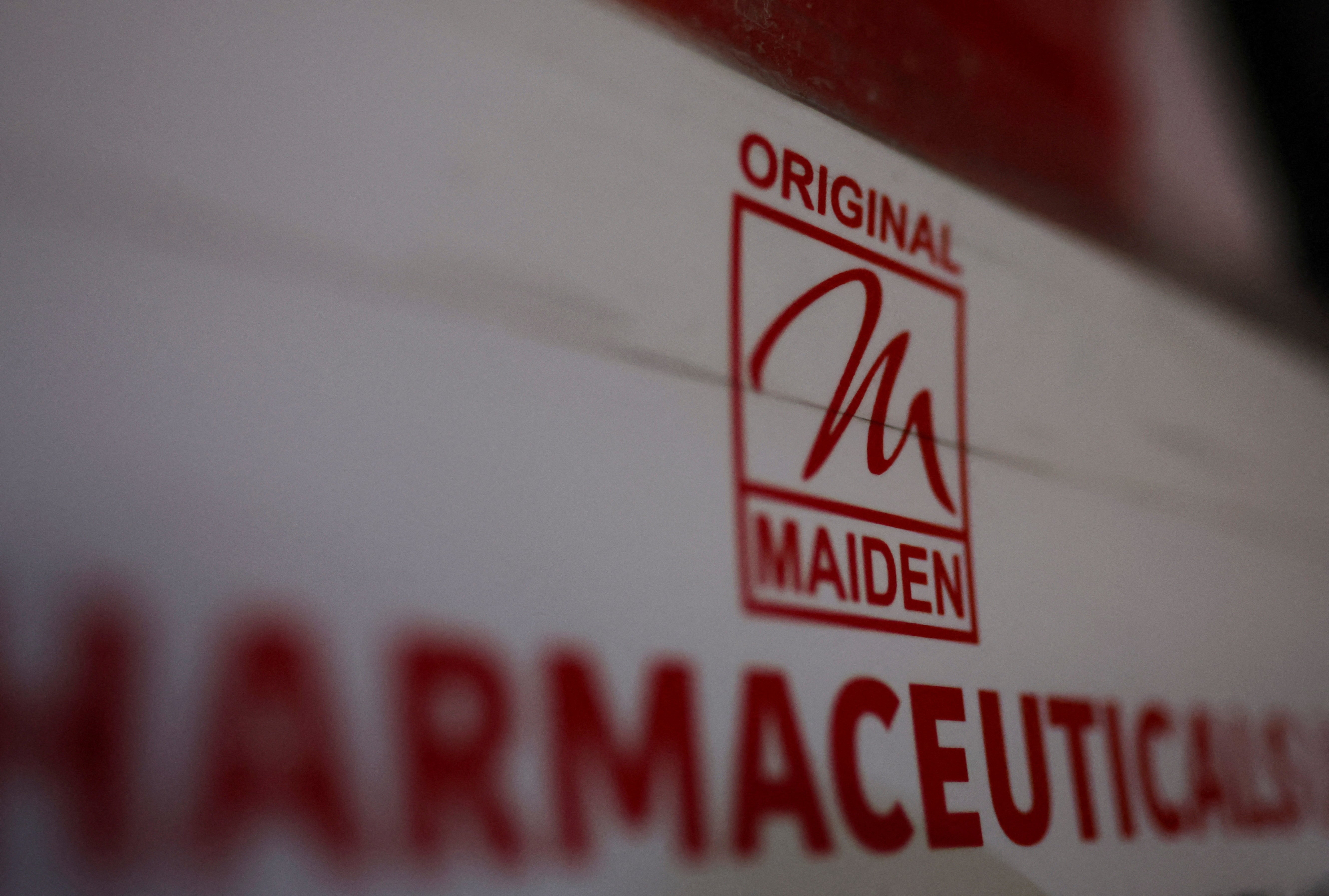 Logo of the Maiden Pharmaceuticals Ltd. company is seen on a board outside their office in New Delhi