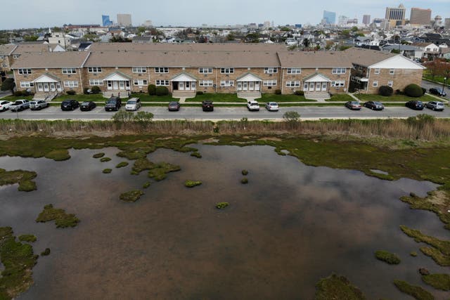 <p>Water pools at the edge of residential district in Atlantic City, New Jersey on Wednesday, Sept. 4, 2022 (AP Photo/Seth Wenig)</p>