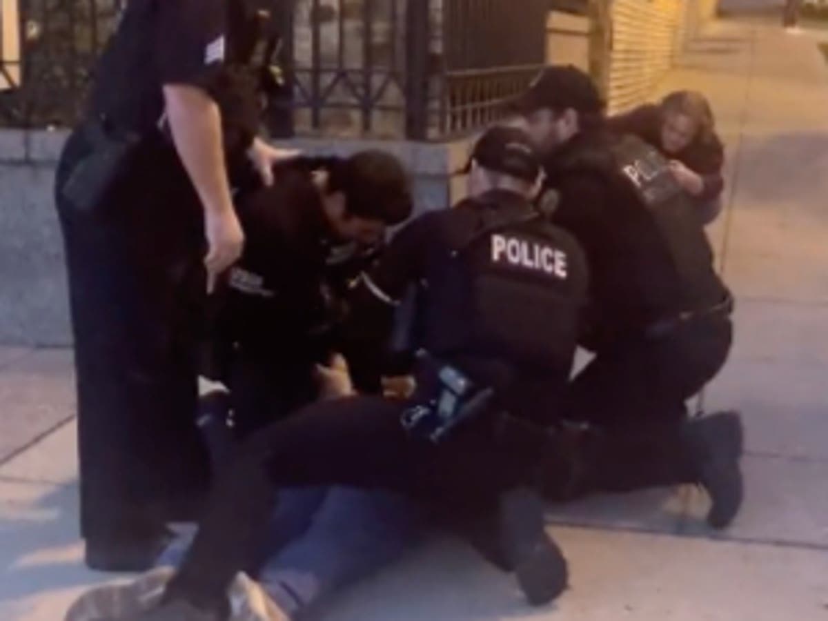 Woman arrested for spitting at officer during protest over Ukraine war outside Russian embassy in Washington 