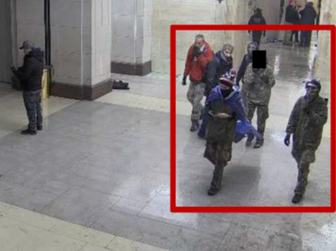 The Munn family appears on surveillance footage walking around the interior of the Capitol building