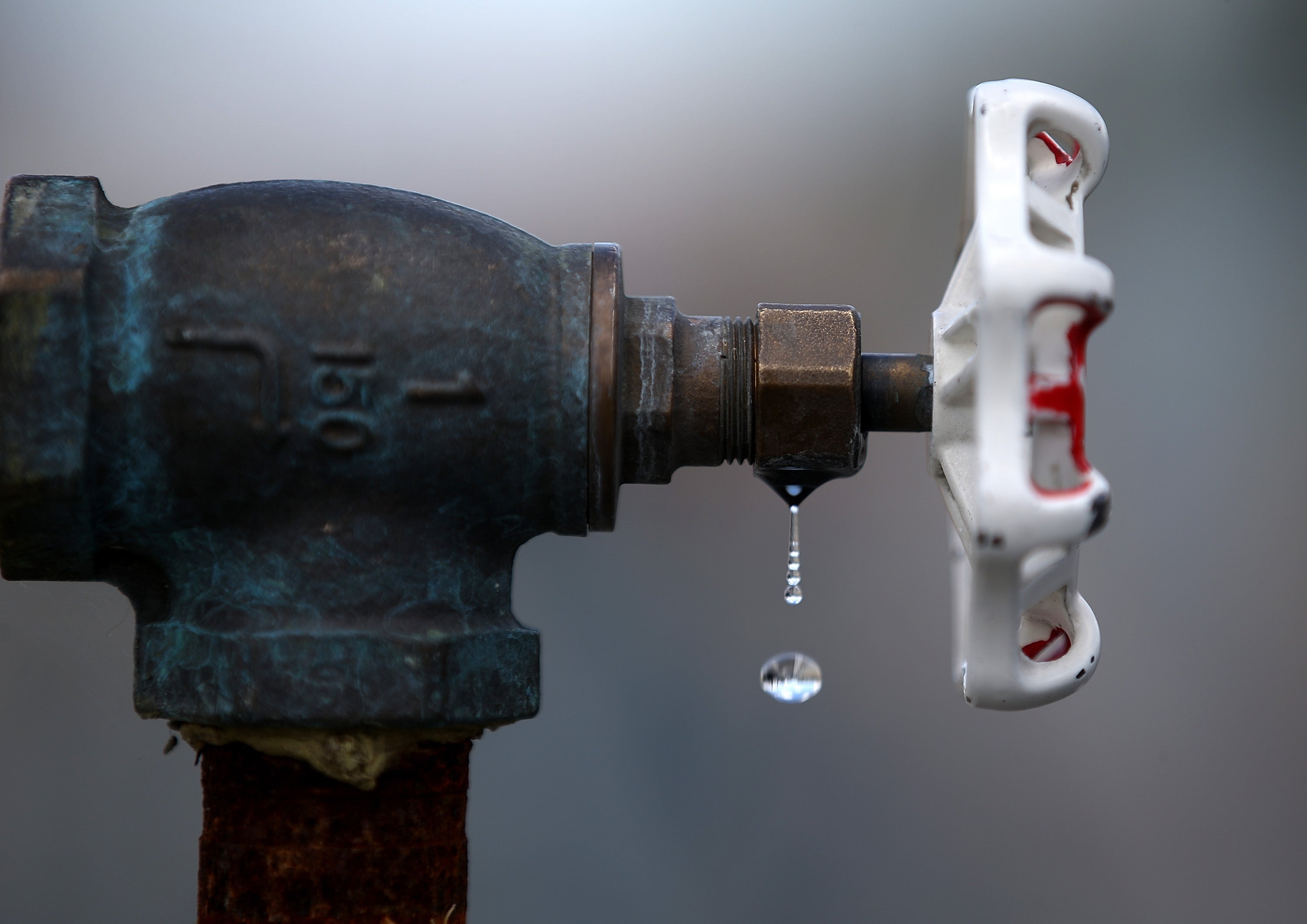 <p>Water drips from a faucet at the Dublin San Ramon Services District (DSRSD) residential recycled water fill station</p>