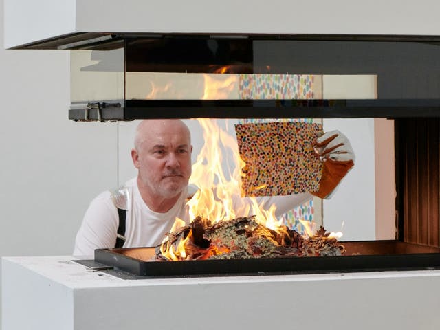 <p>Damien Hirst burning his artworks </p>