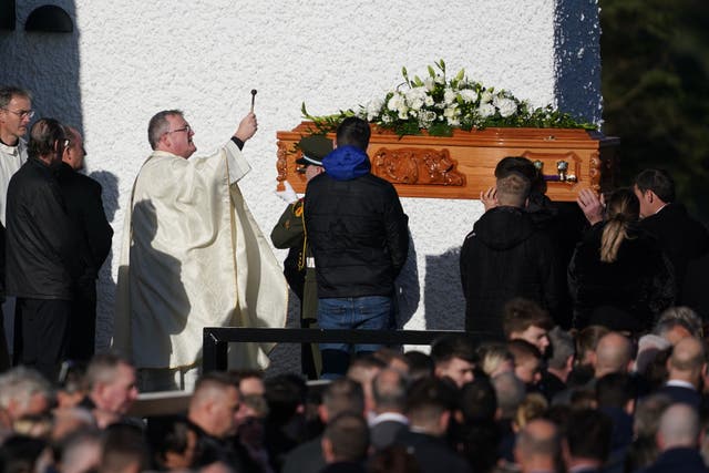 Father John Joe Duffy blesses the coffin of Martina Martin (Brian Lawless/PA)