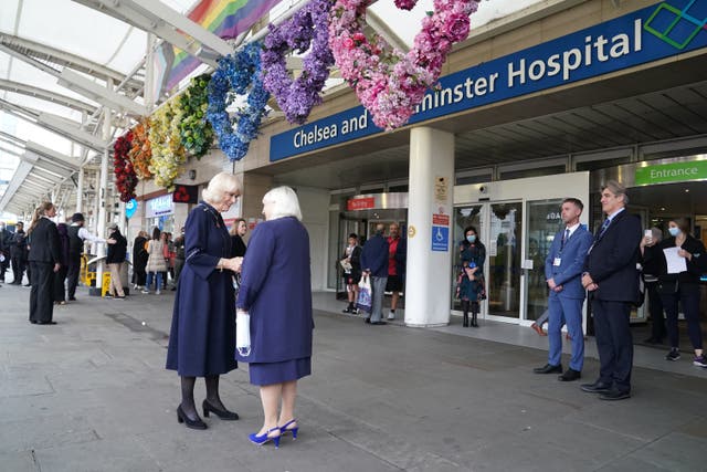 The Queen Consort (left) is greeted by Colonel Jane Davis, Vice Lieutenant of Greater London as she arrives for a visit to a maternity unit at Chelsea and Westminster hospital in London to meet key domestic abuse frontline staff. (Kirsty O’Connor/PA)