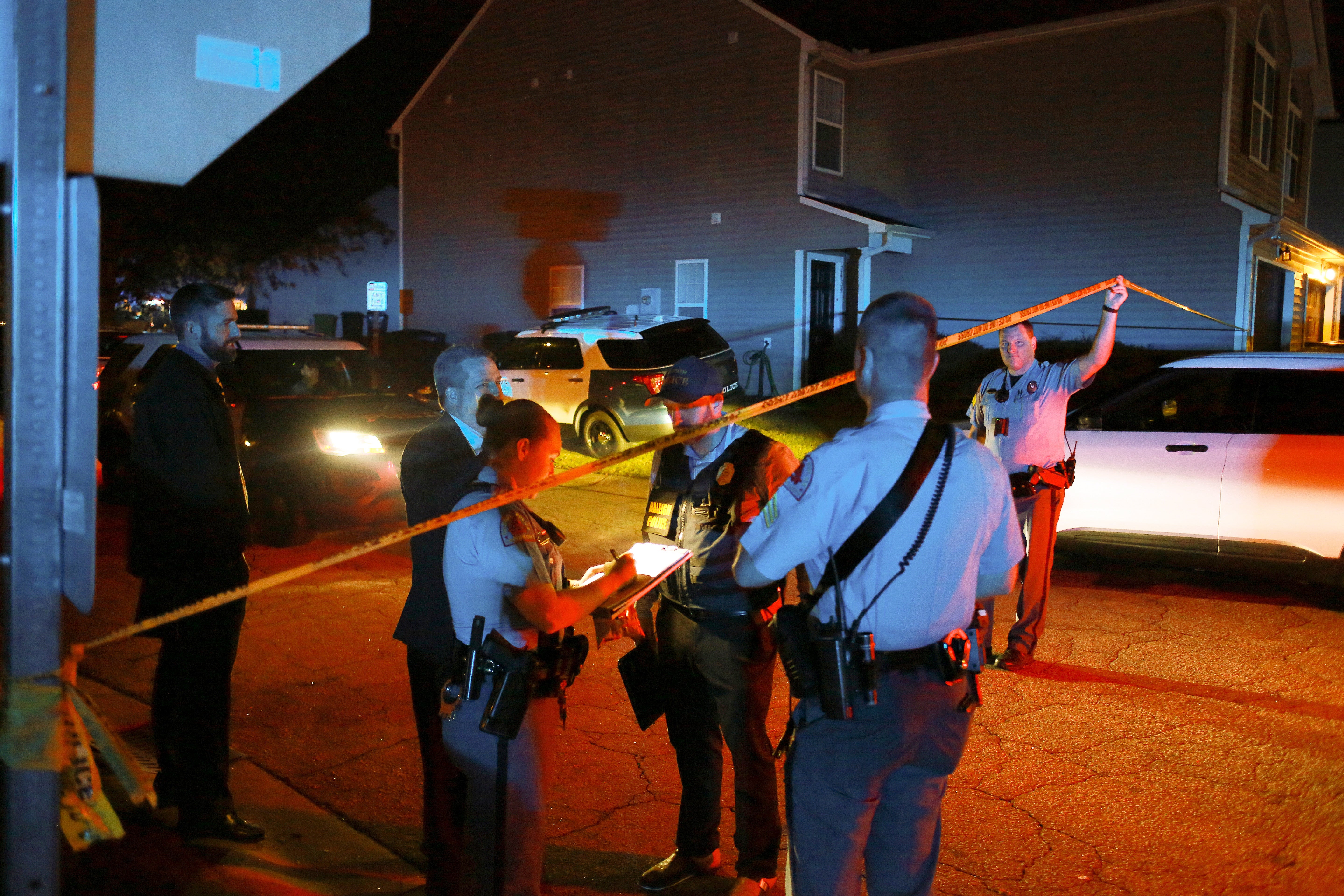 Police officers work in the Hedingham residential neighborhood