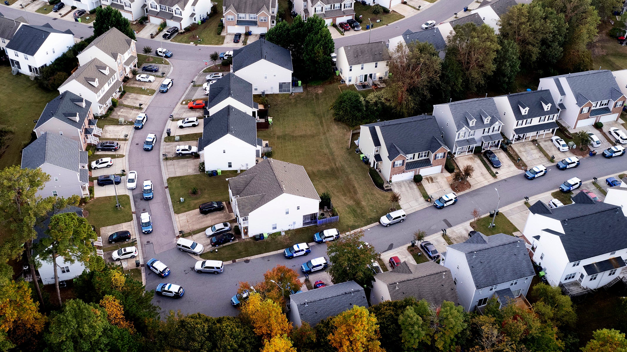 In this aerial image taken with a drone, Law enforcement work at the scene of a shooting in Raleigh