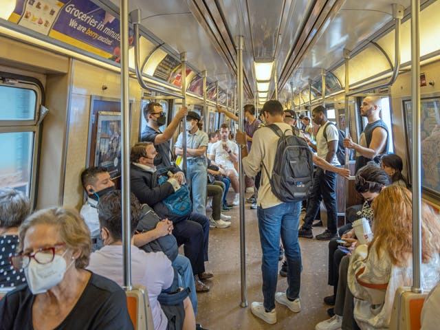 <p>Passengers wear masks in a subway train in New York</p>