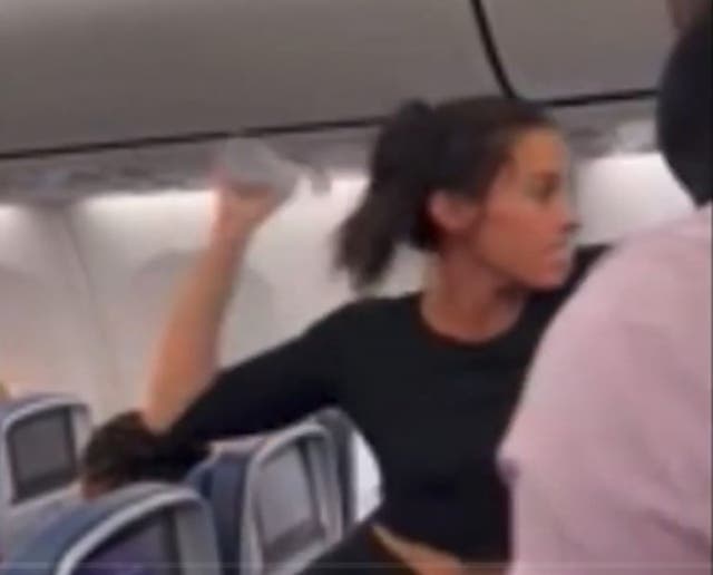 <p>At one point the woman threw her water bottle at a row of passengers behind her</p>