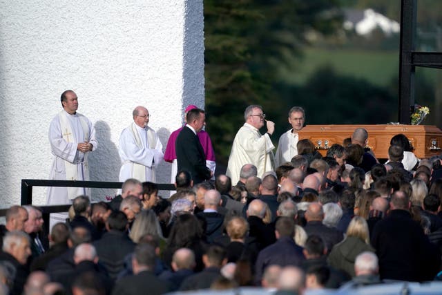 The coffin of Hugh Kelly, who died following an explosion at the Applegreen service station in the village of Creeslough in Co Donegal on Friday, arrives at St Michael’s Church, in Creeslough (PA)