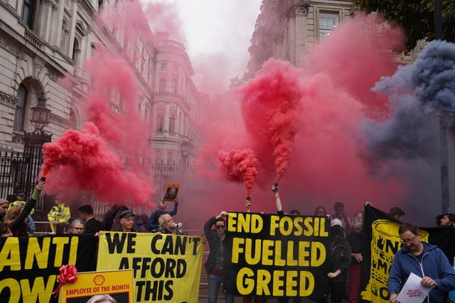 <p>Members of Extinction Rebellion protest outside Downing Street on the day Kwasi Kwarteng said he has accepted Liz Truss' request he "stand aside" as Chancellor. </p>