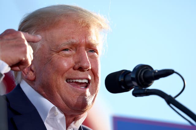 <p>Forme President Donald Trump speaks during a campaign rally at Legacy Sports USA on 9 October 2022 in Mesa, Arizona</p>