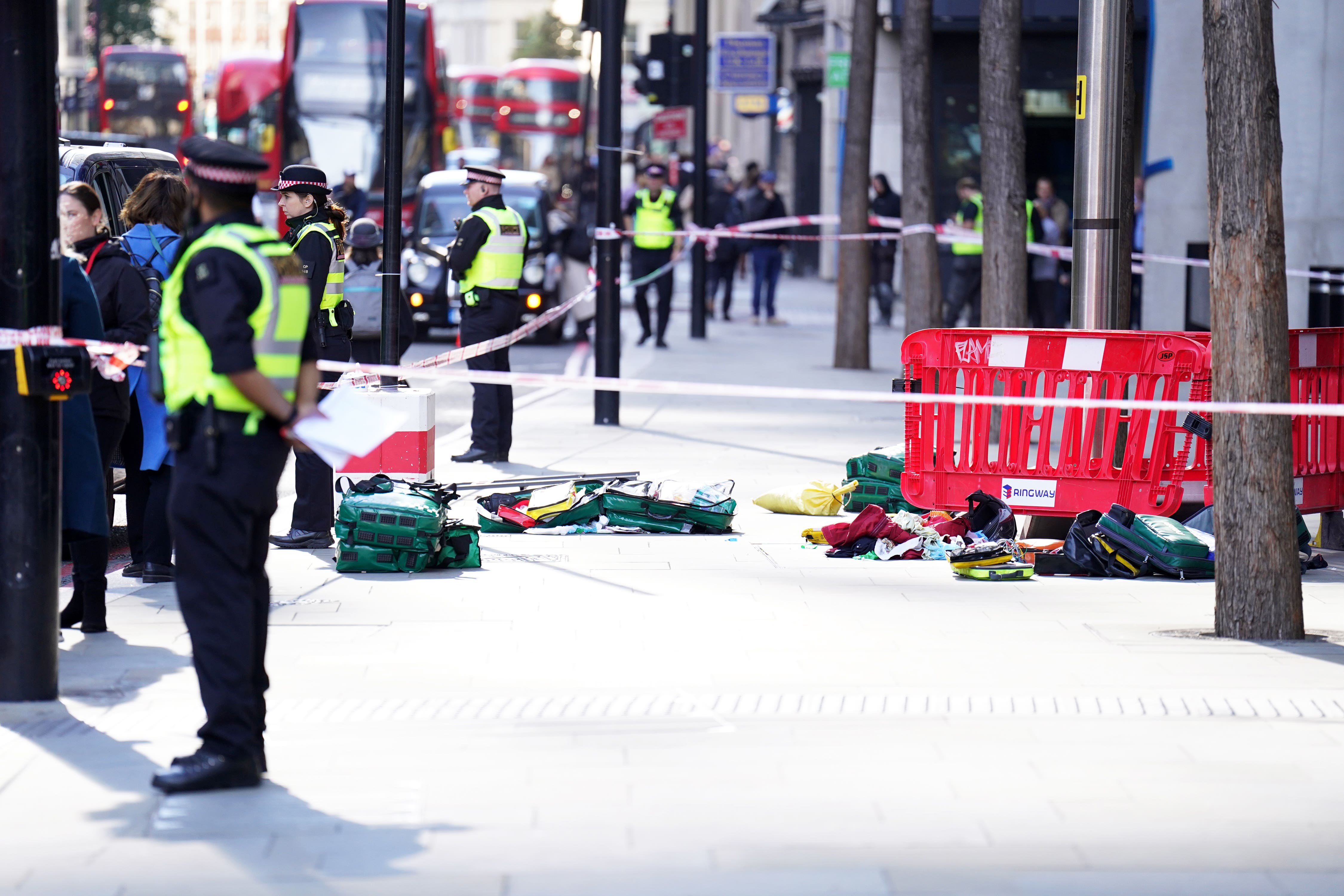 Police officers at the scene after three people have been taken to hospital following a knife attack (James Manning/PA)