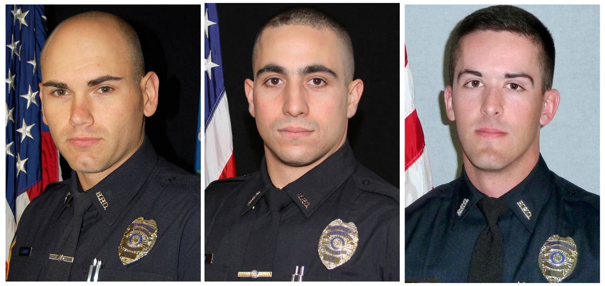 Medical examiner: 2 officers died from multiple gunshots