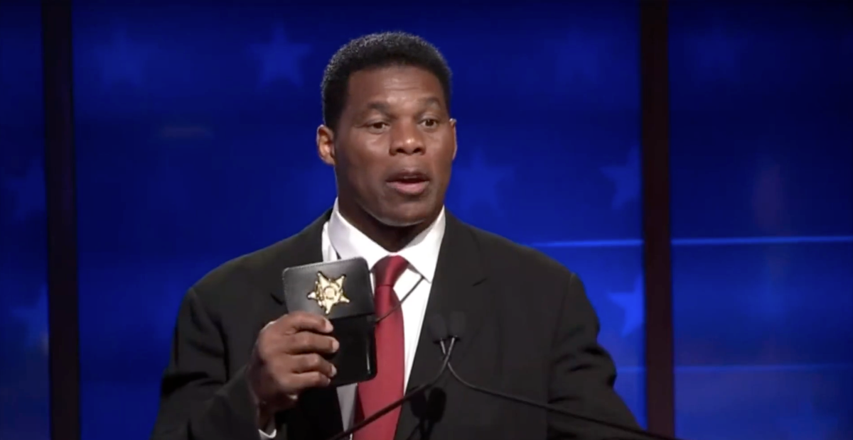 Herschel Walker called out for ‘prop’ badge during debate when accused of lying about working as a sheriff