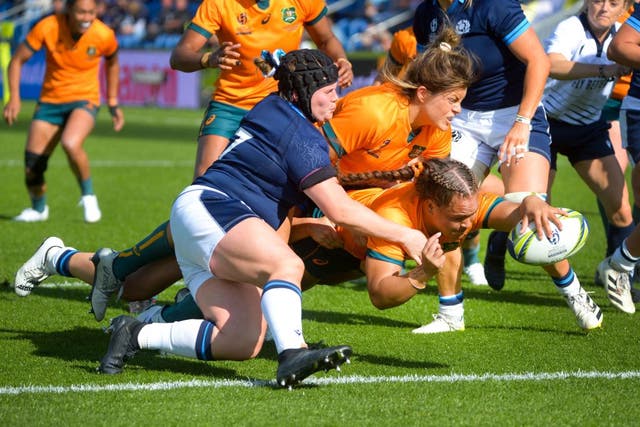 <p>Australia’s Ashley Marsters scores her side’s second try during the Pool A win over Scotland on Saturday </p>