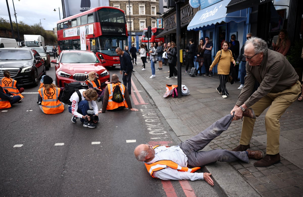 Public clash with Just Stop Oil protesters blocking east London road