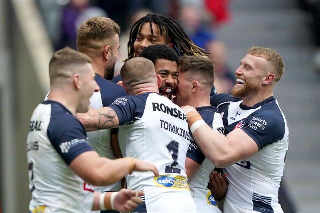 England celebrate their fourth try against Samoa (Owen Humphreys/PA)